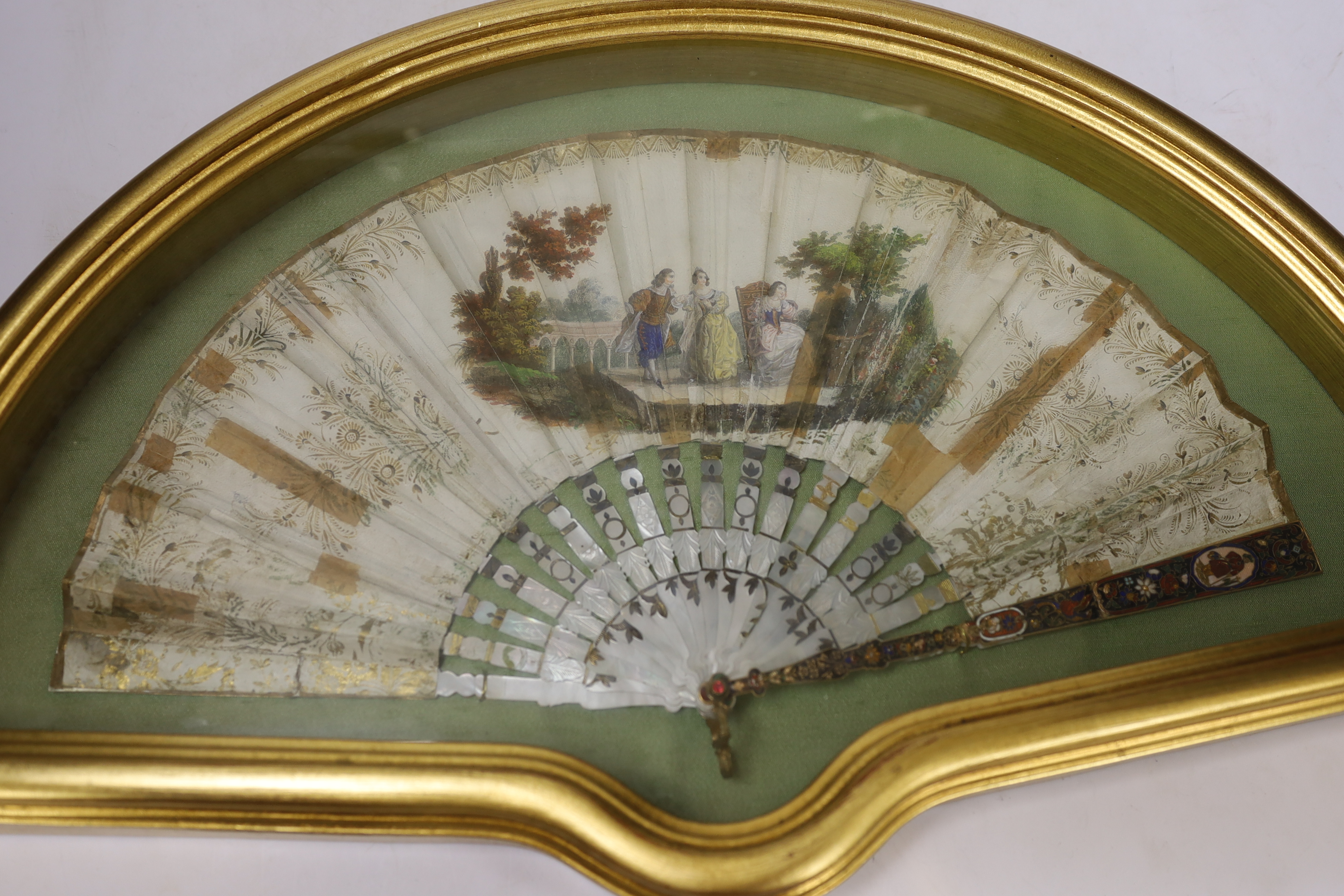 A cased early 19th century French mother of pearl, printed and painted fan
